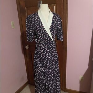 Size 10 short sleeve dress. Pink flowers on navy blue.